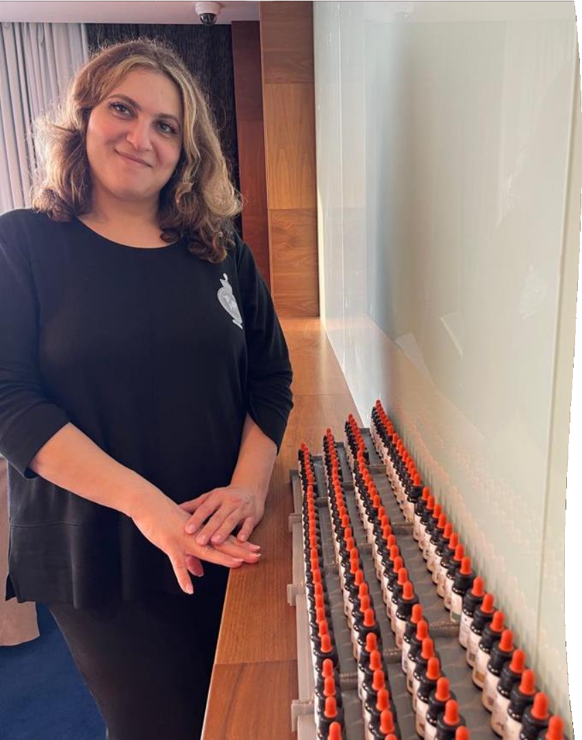 Amira El Aasar beside a collection of perfumery materials